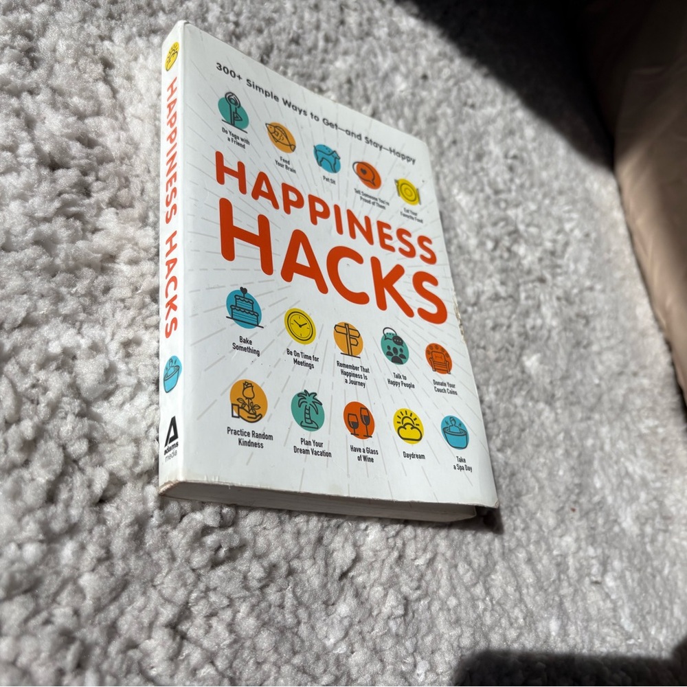 White and Orange Happiness Hacks Book with Colorful Icons